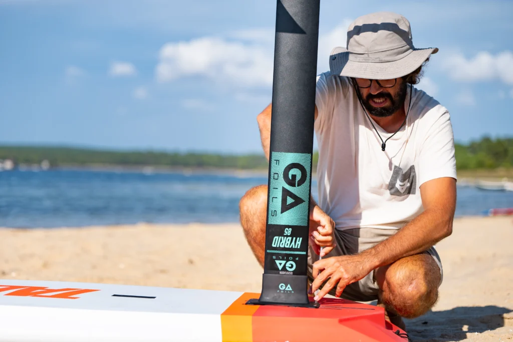 Complete Wingfoil gear ready for a session in the lagoon