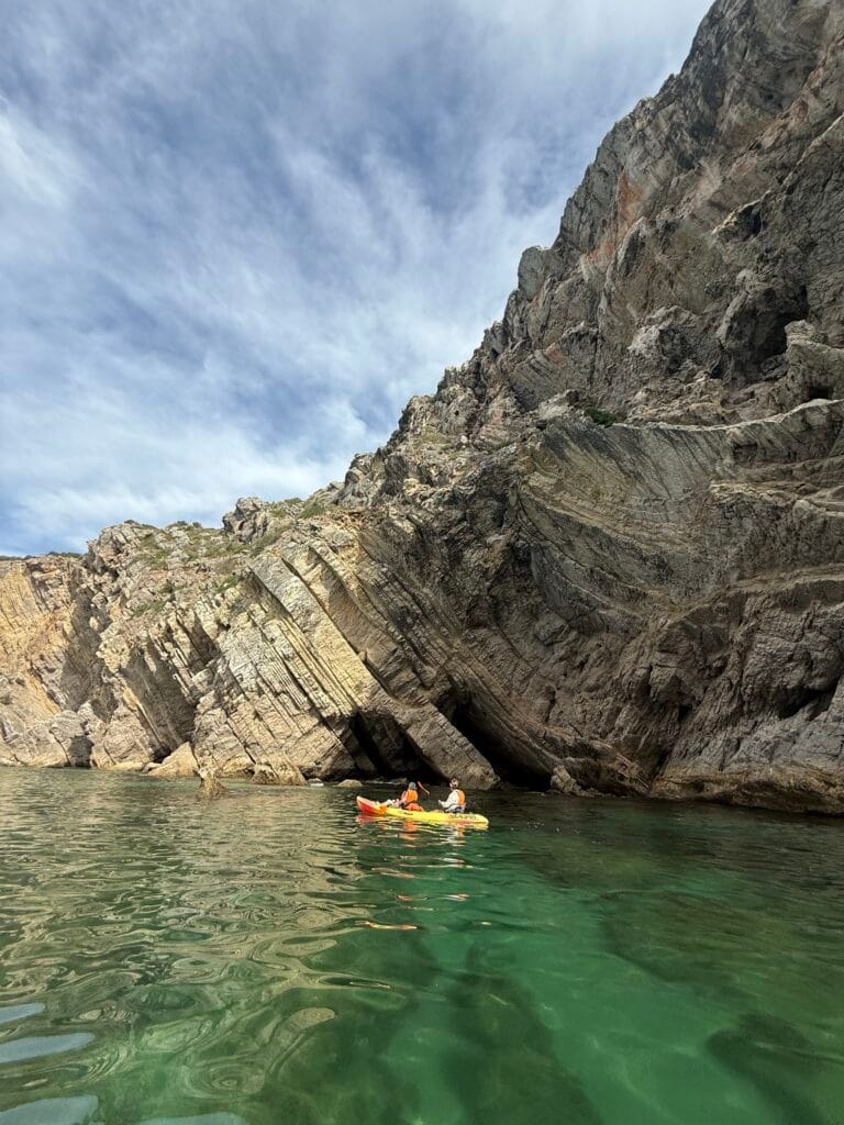 Kayaking in Arrabida: Best Kayak Tour in Sesimbra (2026 Guide) 17 Arrábida coastline cliffs turquoise water kayaking