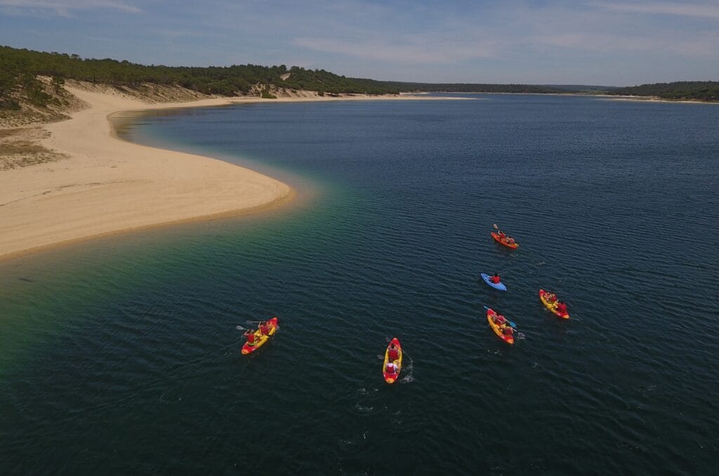 Best Things to Do in Sesimbra with Kids 2026: The Complete Family Guide 16 Lagoa de Albufeira kids kayak SUP flat water Sesimbra family activity